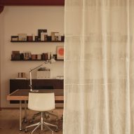 Neutral workspace with sheer curtain