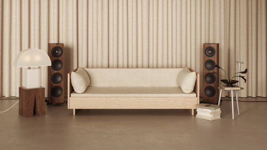 Photo of a sofa, lamp and speakers