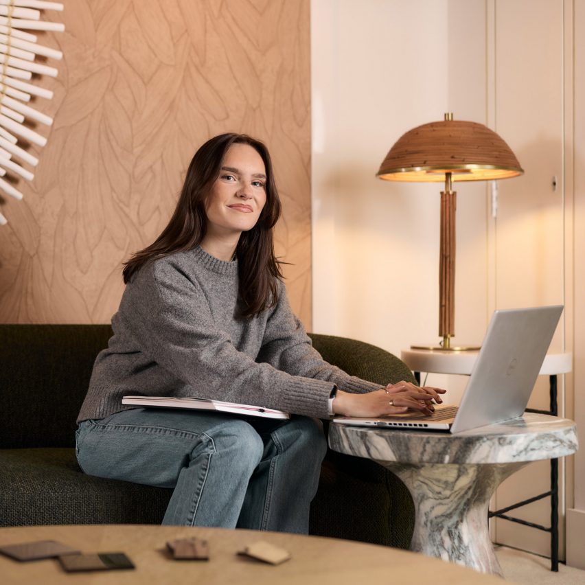 a photograph of a person working at a computer