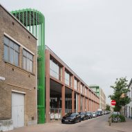 Bright green stairwells bookend school workshops in Belgium