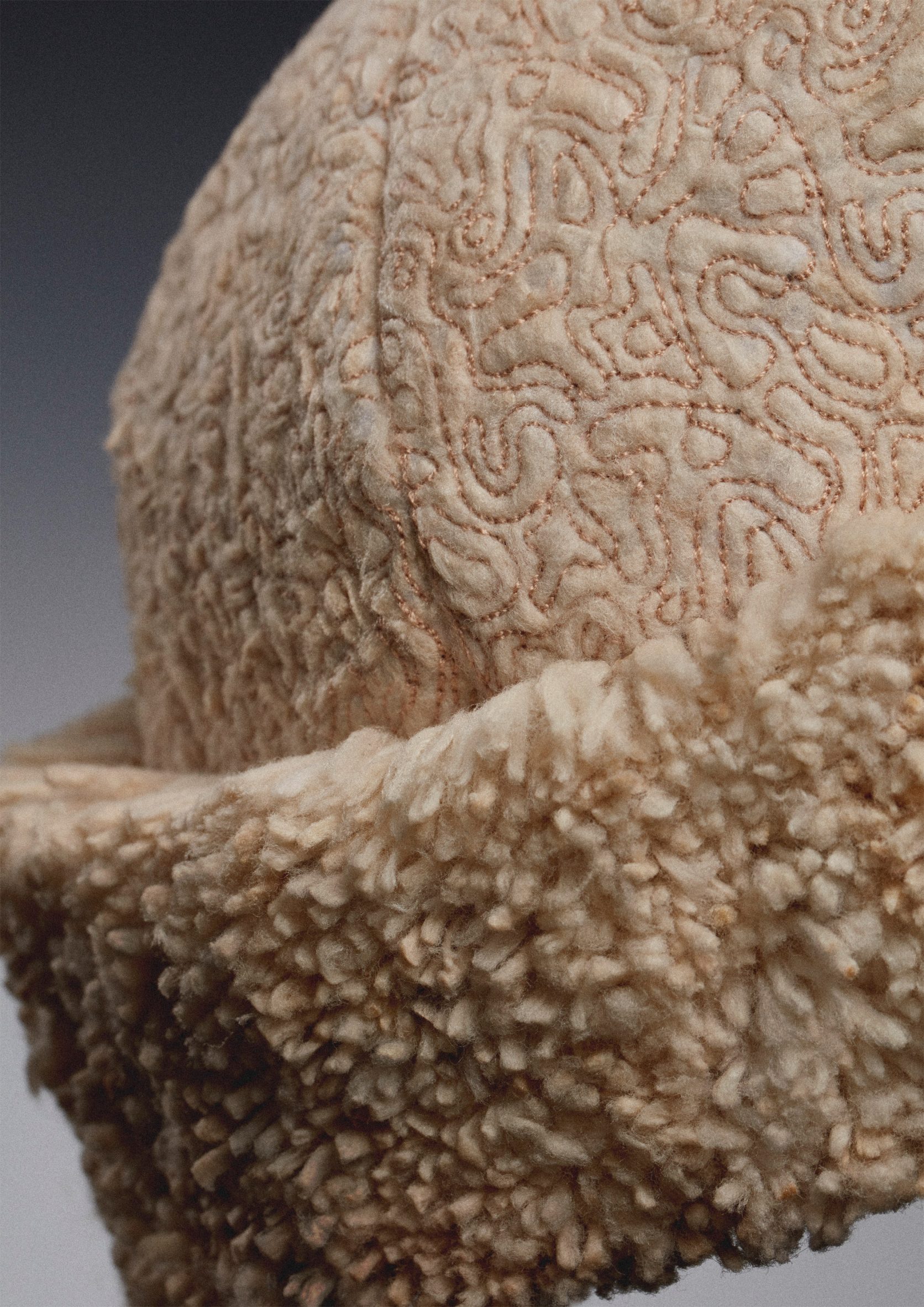 Olivia Gino turns waste cigarette butts into fuzzy hat