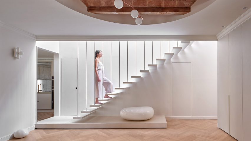 Interior of flat with white staircase