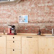 Wooden furniture and brickwork at Podimo Norway office by Omhu Projects