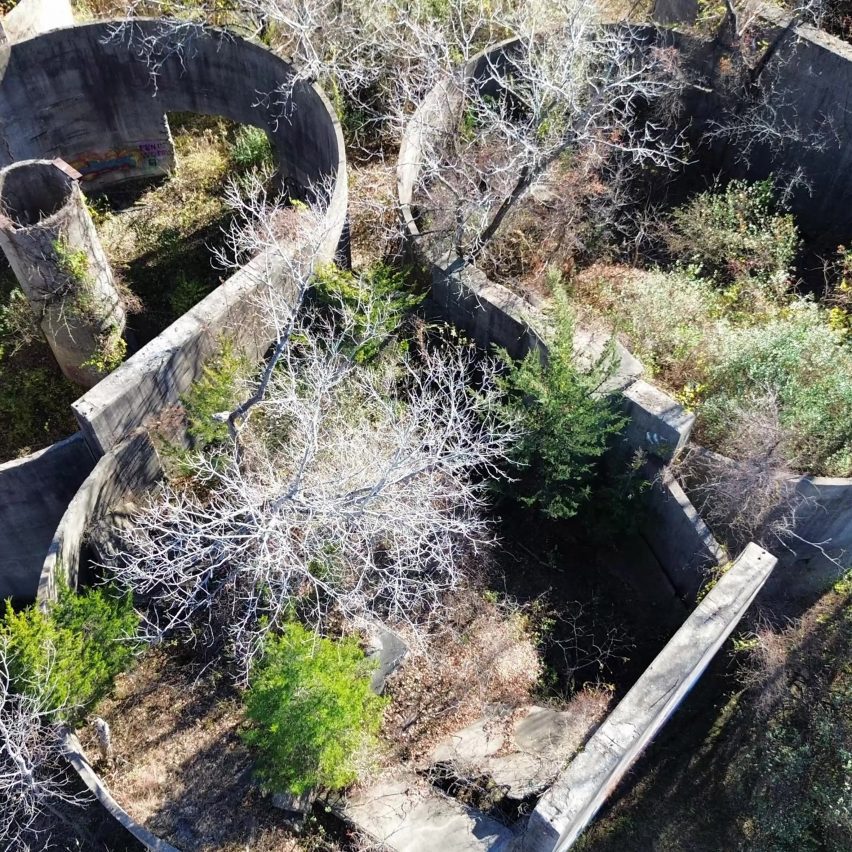 an image of a landscape from above in tones of grey, brown and green