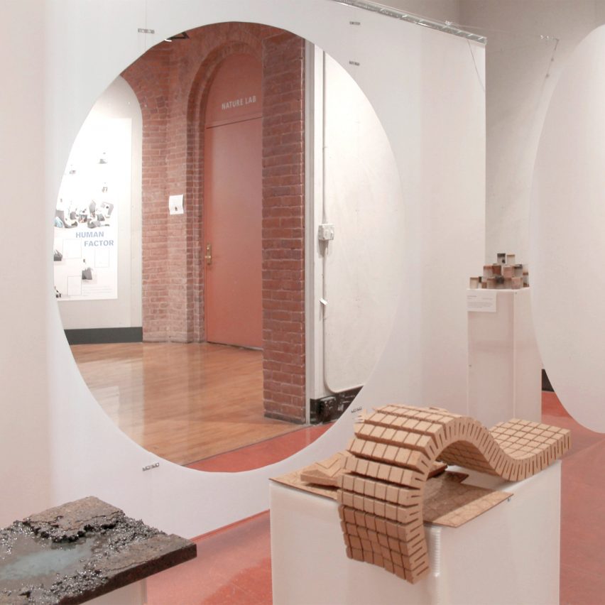 an image of an interior space in tones of white and pink