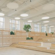Space finished with pale-toned timber and plants