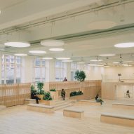 Multi-level educational space with timber finishes