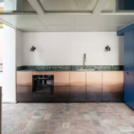Kitchen with marble counter in RA House by StudioTamat
