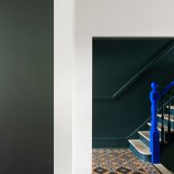 Bright blue bannister staircase