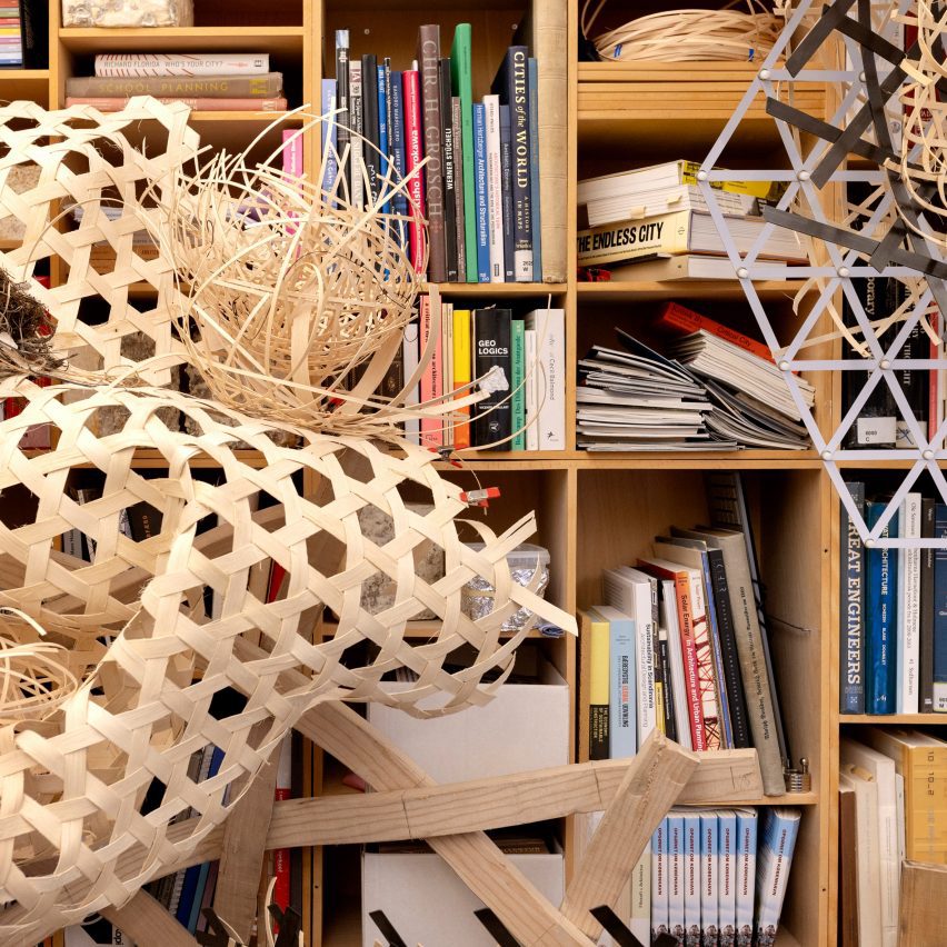 an abstract structure in front of a shelf