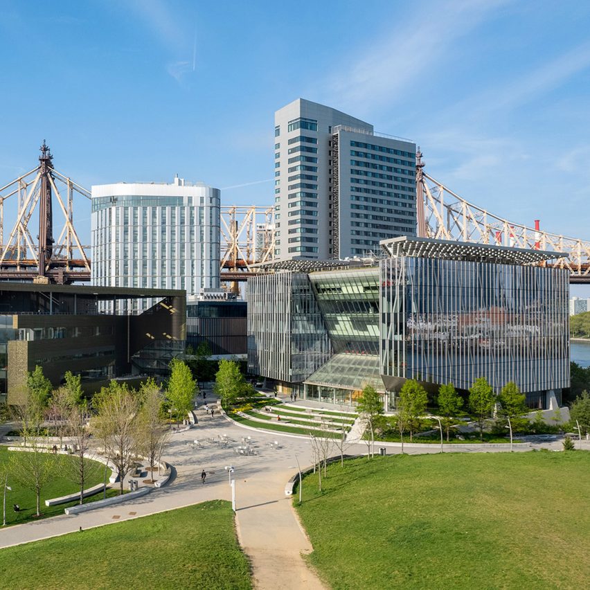 a photograph of a park with high rise buildings around it