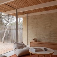Living space timber ceiling and brick wall