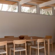 Dining area with white wood panelling