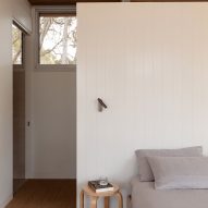 Bed with wood panelling details