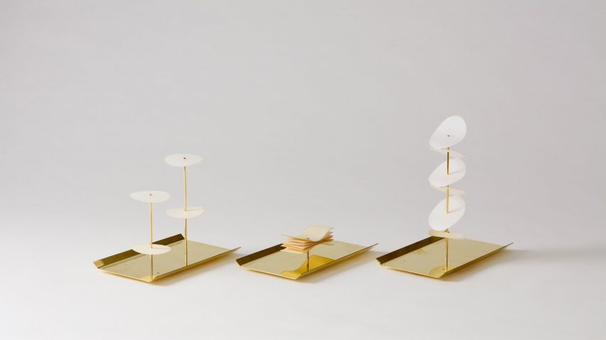 brass and wax paper candles