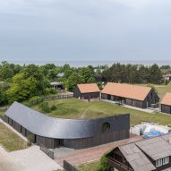 Twisting slate roof tops coastal Latvian home by Made