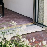 Door step in Stone and Steel House extension by DGN Studio and Sarah Izod