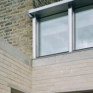 Stone bricks and stainless steel windows in Stone and Steel House extension by DGN Studio and Sarah Izod