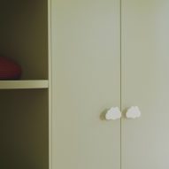 Green wardrobe with cloud-shaped handles
