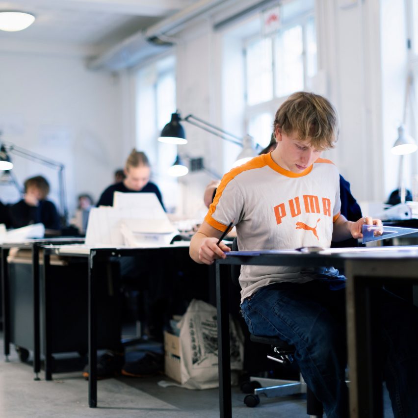 a photograph of a student working at a desk