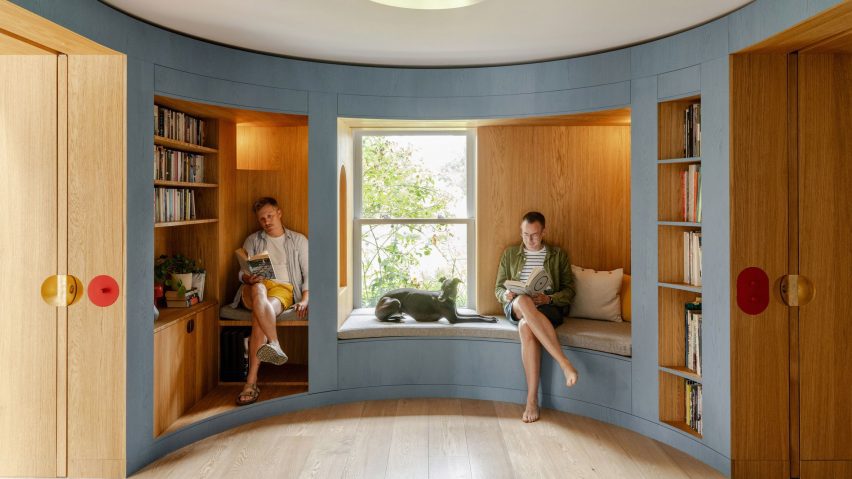 Curved blue timber library seating area