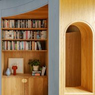 Curved timber library wall with seating nook