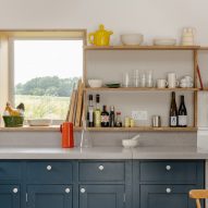 Country house kitchen with dark blue cabinets