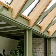 Green painted timber pitched conservatory roof