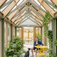 Yellow table seating area in conservatory