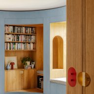 Nook seating area cut into curved timber library wall