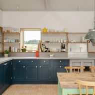 Kitchen with dark blue cabinets