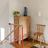 Kent house bedroom with timber and red staircase