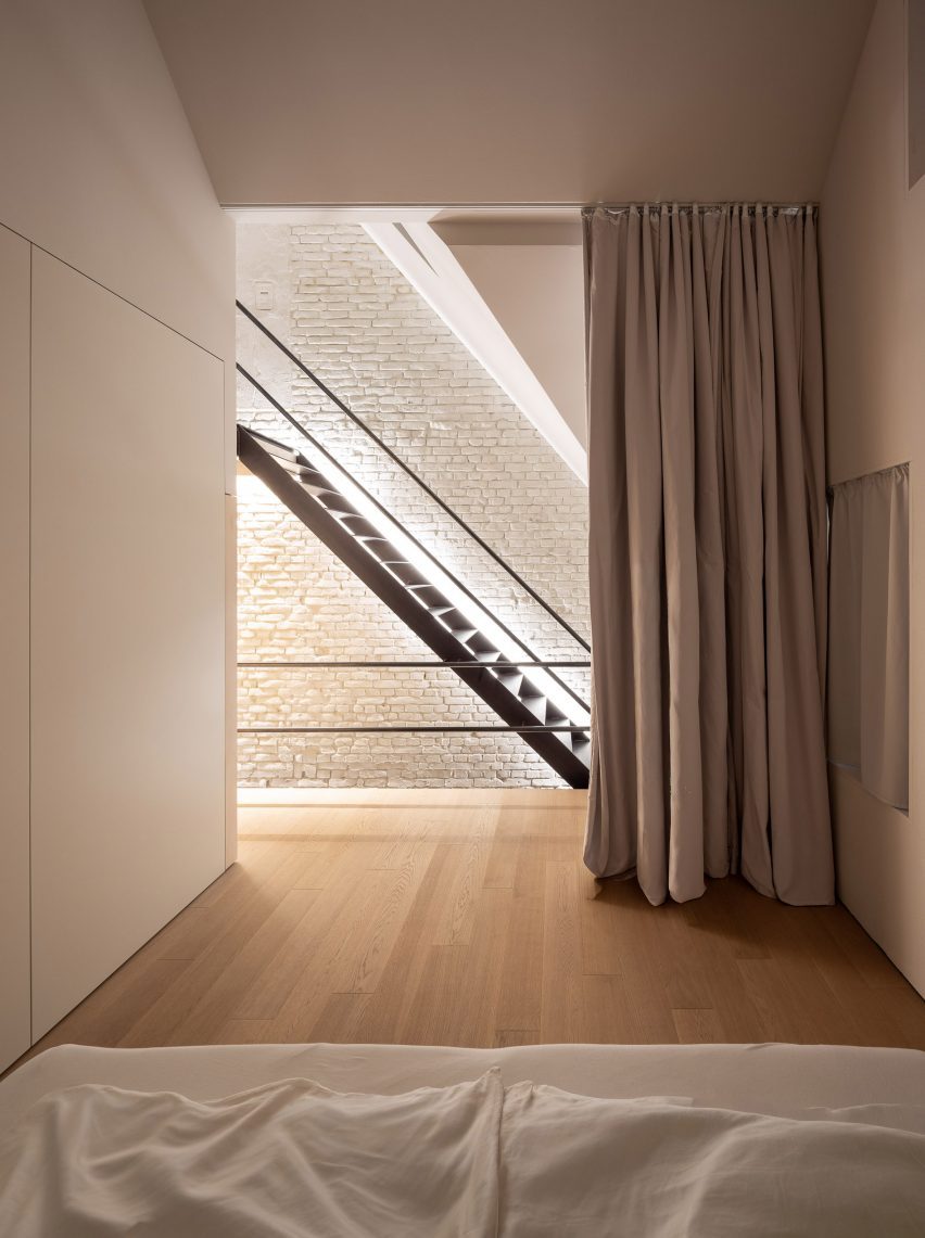 Bedroom interior at house conversion by Andreas Schüring Architekten