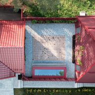 Courtyard between two red buildings