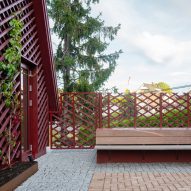 Courtyard with red house extension
