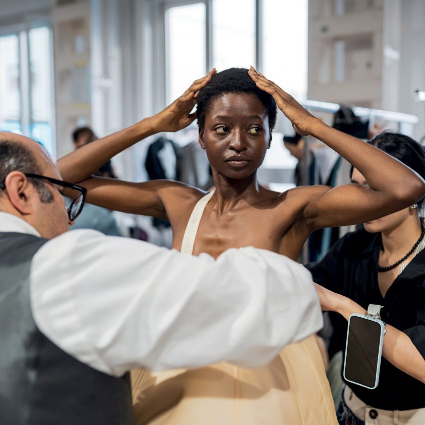 photo of model getting clothes fitted