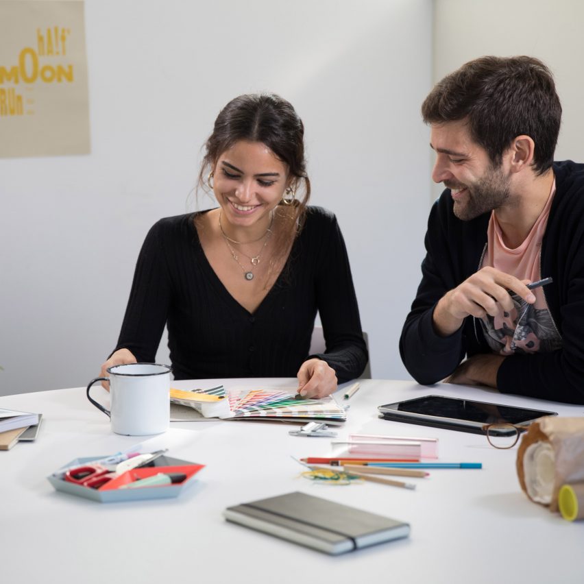 photo of two people looking at colour palettes