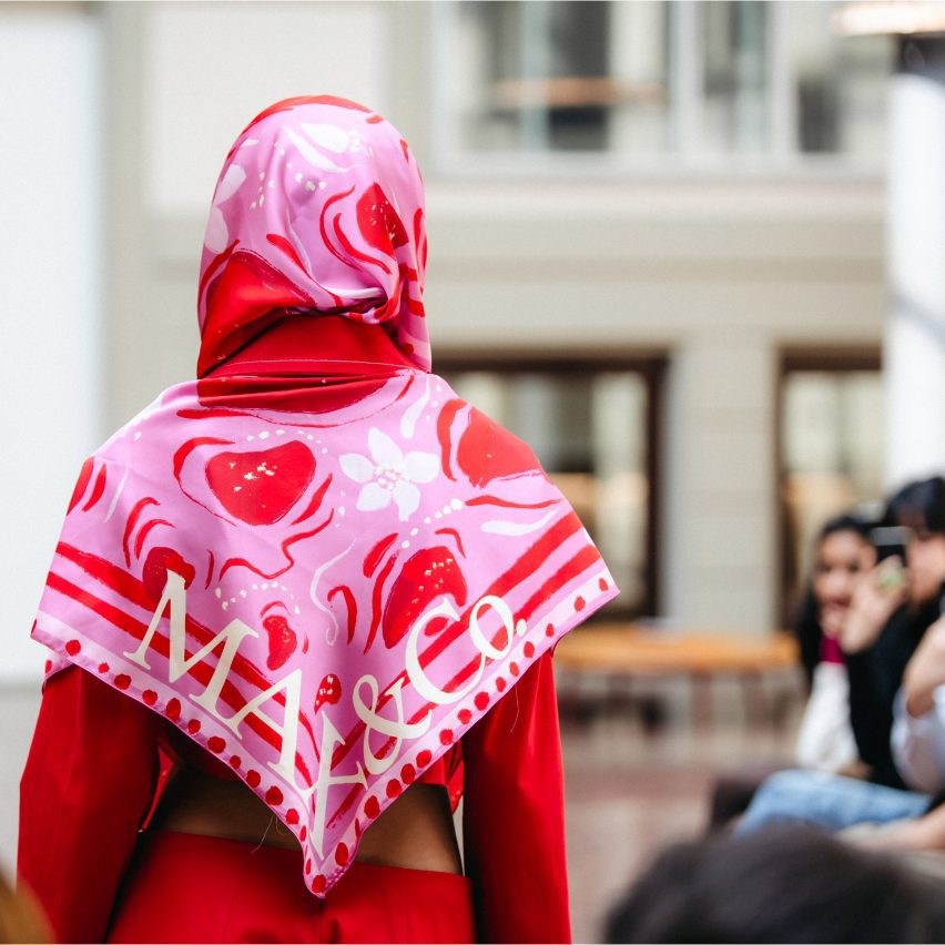 photo of model walking runway