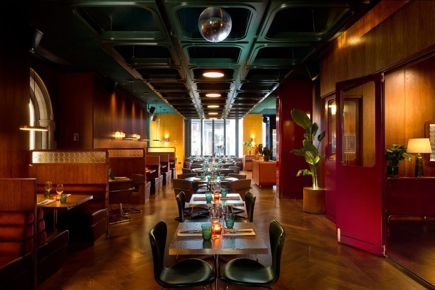 Restaurant with wood floor and green ceiling