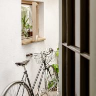 Bicycle leans against a window in A Simple Addition by OEB Architects