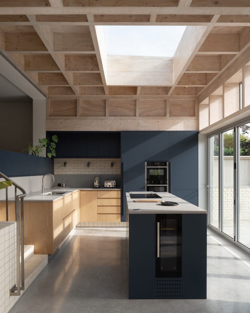 Kitchen with island in Tabberner Cook House by James Alder Architects