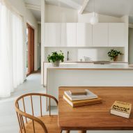 Minimal kitchen with wooden table