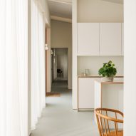 Long hallway leading away from kitchen
