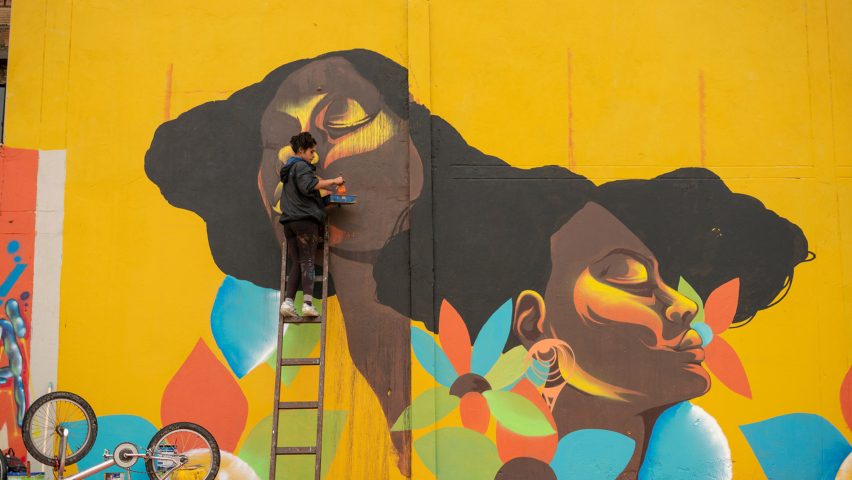 Artists painting mural