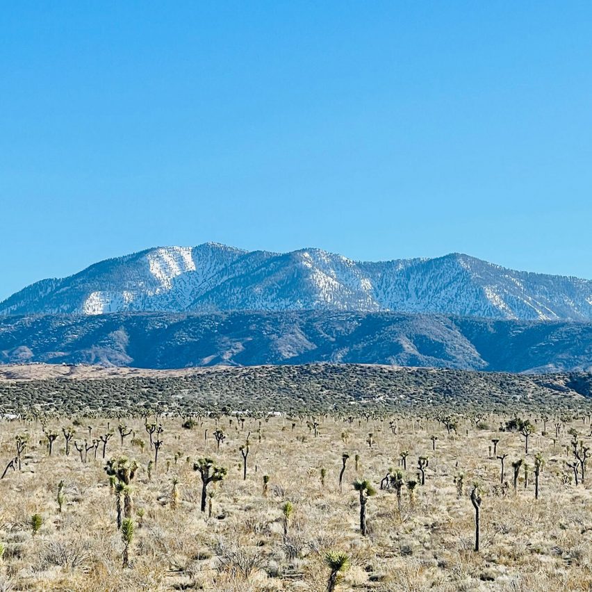 an image of a mountain against a blue sky