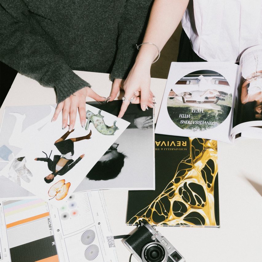 a photograph of people going through magazines