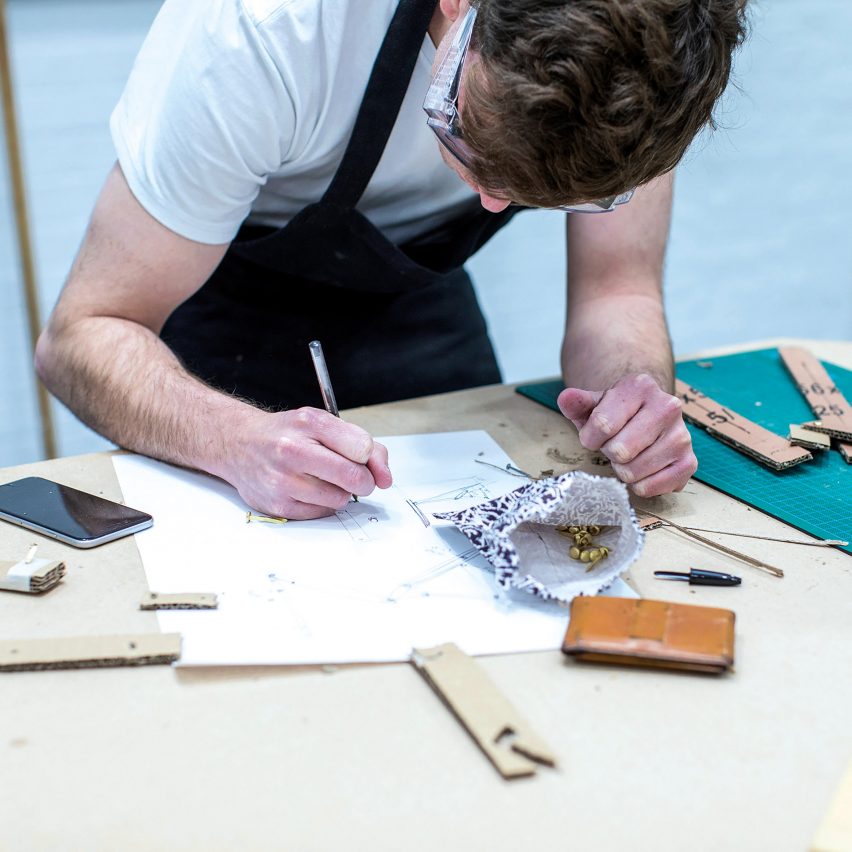 a photograph of a person working at a desk