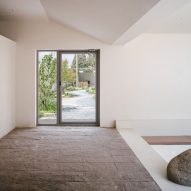 Lobby with stone floor and sunken seating area