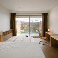 Guest bedroom with private outdoor space beyond
