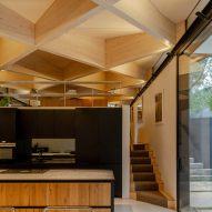 Kitchen with exposed timber diagrid roof in Arbour House by Andrei Saltykov